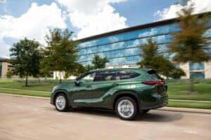 2024 Highlander in Cypress Green in front of a business center in Auburn, CA