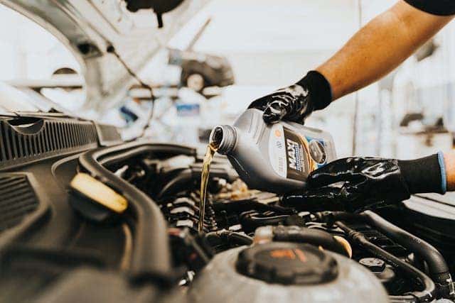 Pouring Oil in Engine