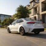 2026 Toyota Corolla driving down a street