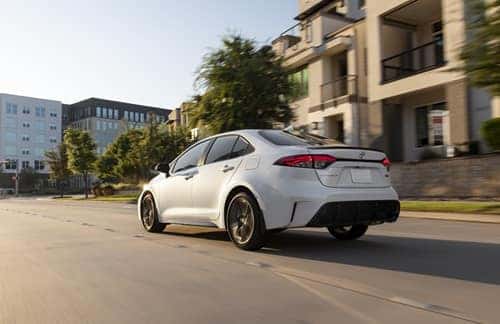 2026 Toyota Corolla driving down a street