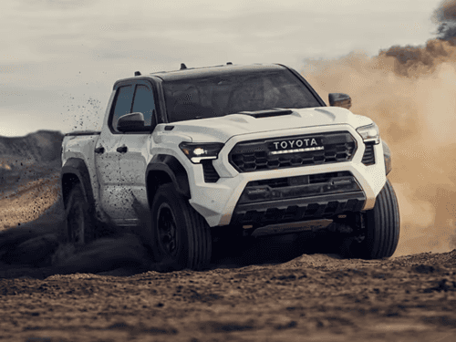 Toyota Tacoma on a Hillside driving in dirt