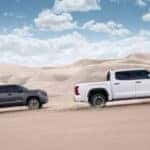 Two Toyota Tundra Racing Through Desert