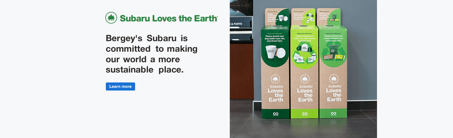 Subaru Loves the Earth. Green recycle bins with green font.