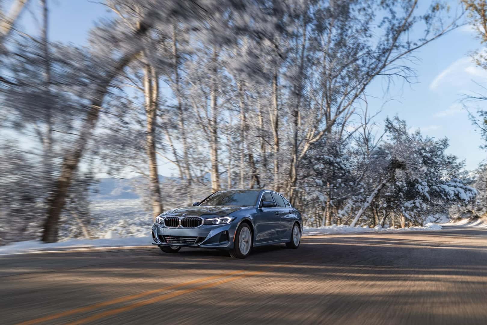 BMW 3 Series Driving Down Road in the WinterBMW 3 Series Driving Down Road in the Winter