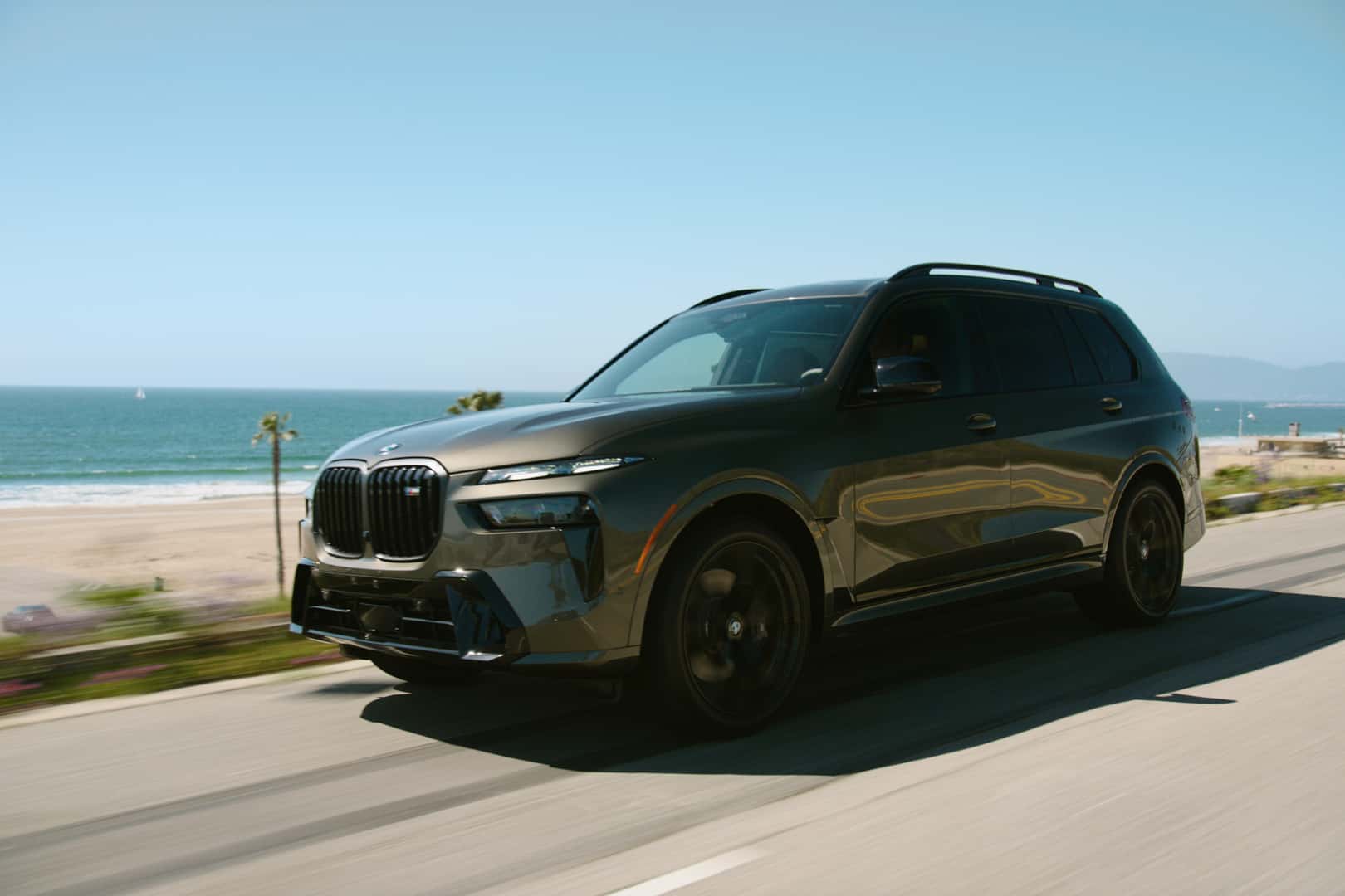 2026 BMW X7 Driving down a costal road