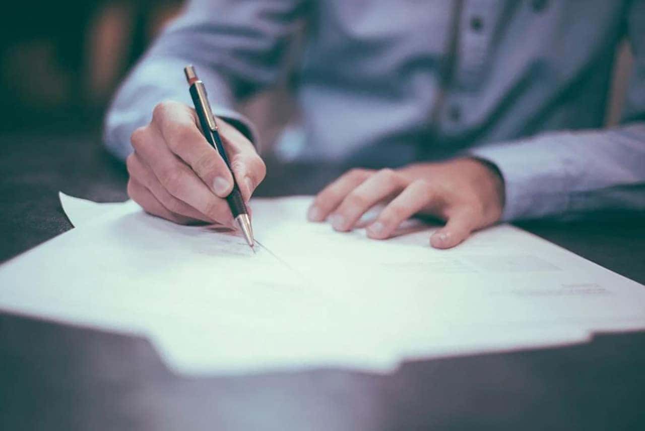 signing car loan paperwork