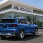 2026 BMW X5 shown from the rear three-quarter angle