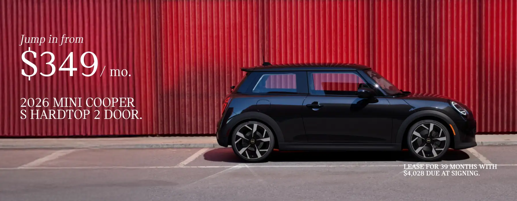 2026 MINI Cooper S Hardtop 2 Door parked in front of a red wall with promotional text advertising a $349 monthly lease.