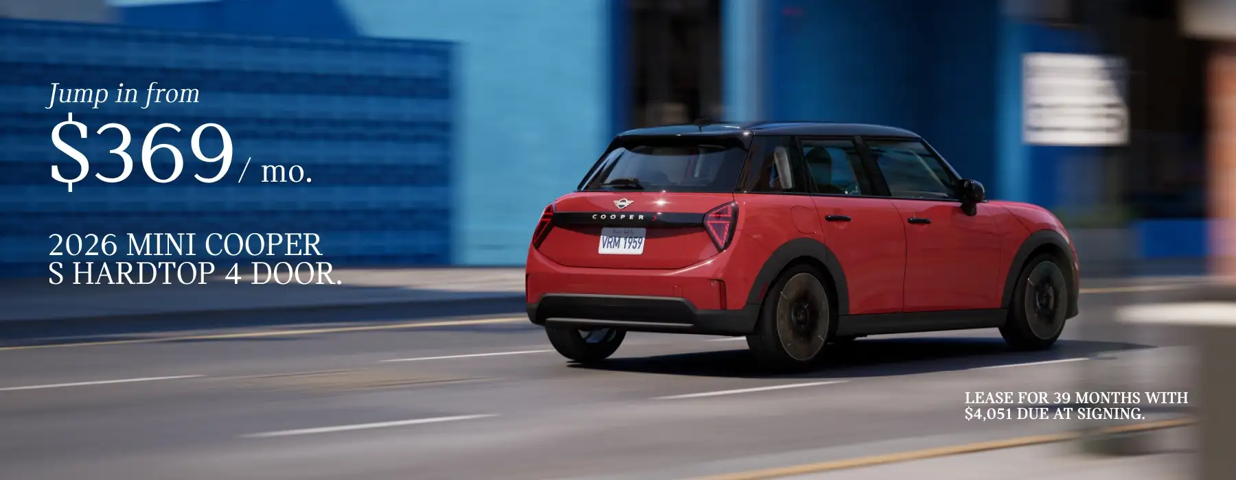 2026 MINI Cooper S Hardtop 4 Door driving on a city street with promotional text advertising a $369 monthly lease.