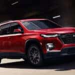A red Chevy Traverse on the highway