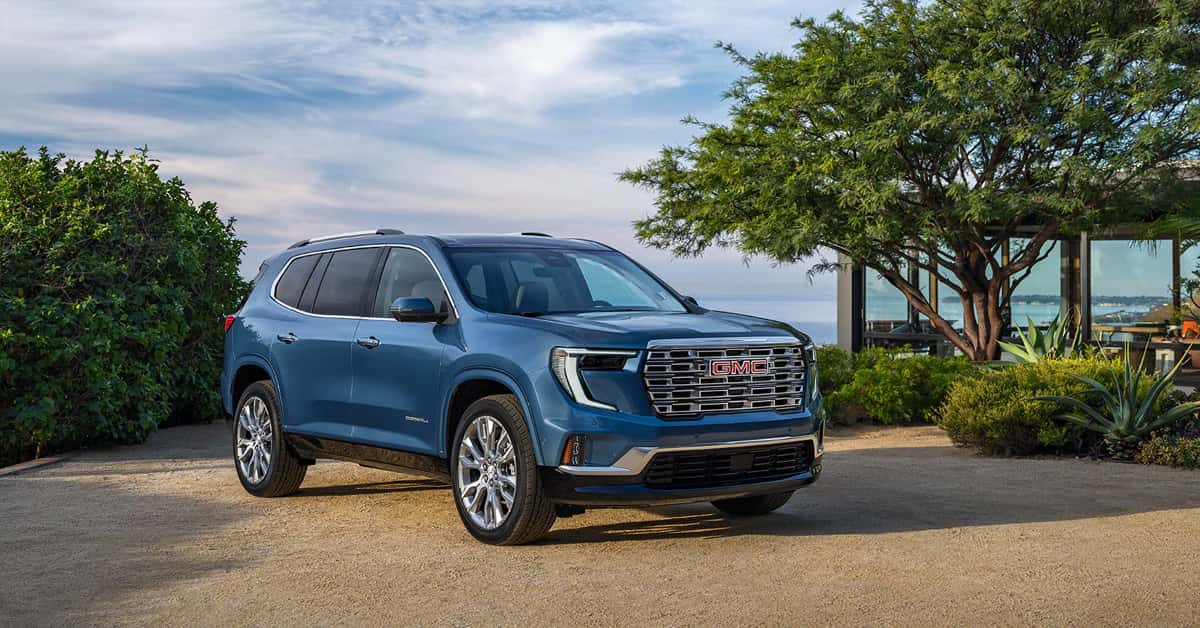 A blue 2026 GMC Acadia parked outdoors