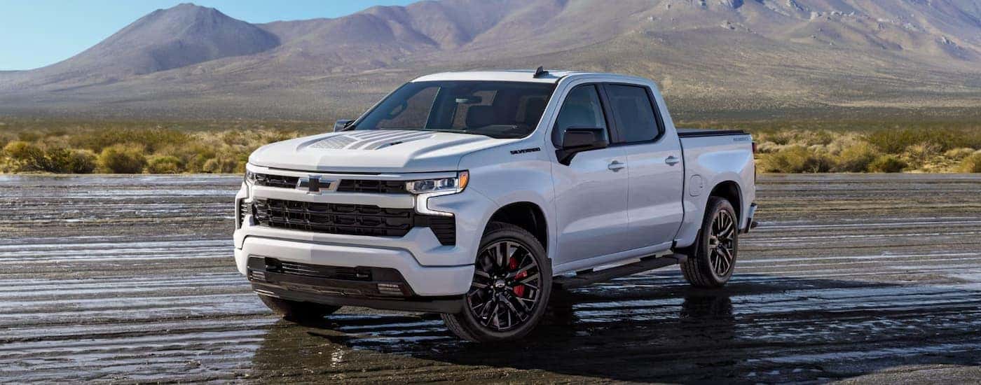 White 2026 Chevy Silverado 1500 driving off-road.