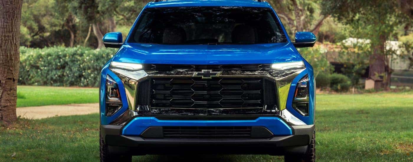 Front grille view of a blue 2027 Chevy Equinox.