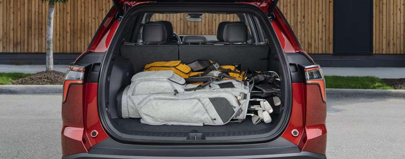 Rear cargo view of a red 2027 Chevy Equinox.