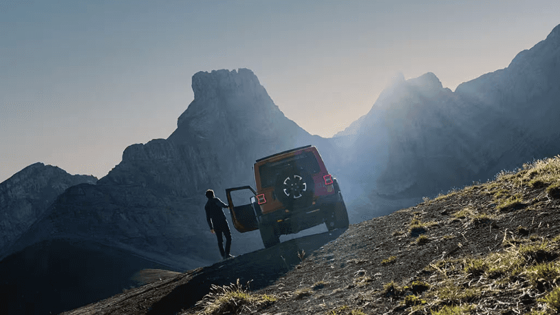 Jeep Wrangler parked on the side of a mountain