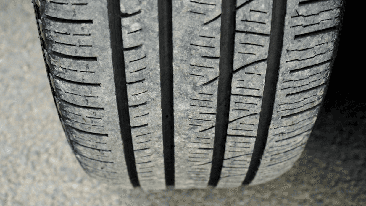 Close up of vehicle tire on asphalt