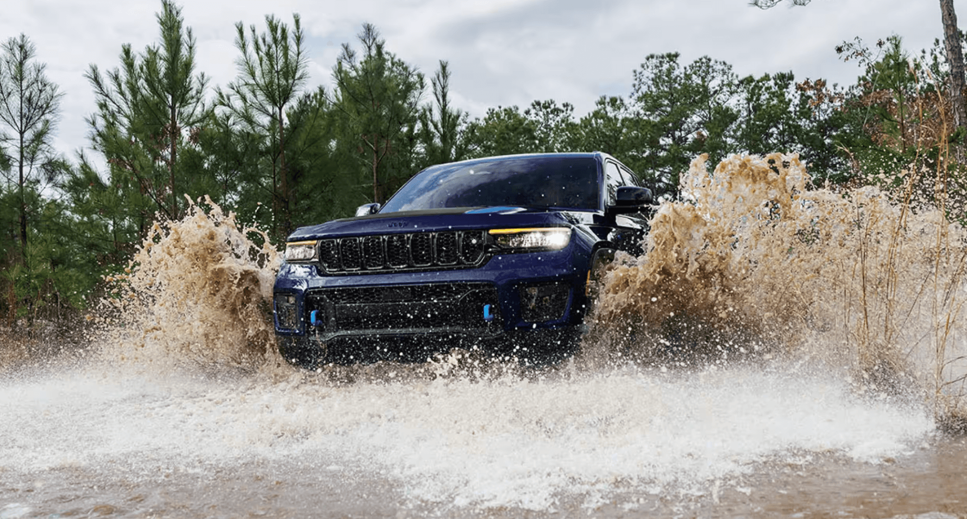 2024 Jeep Grand Cherokee makes a splash--demonstrating high air intakes, special water sealing, and air suspension system
