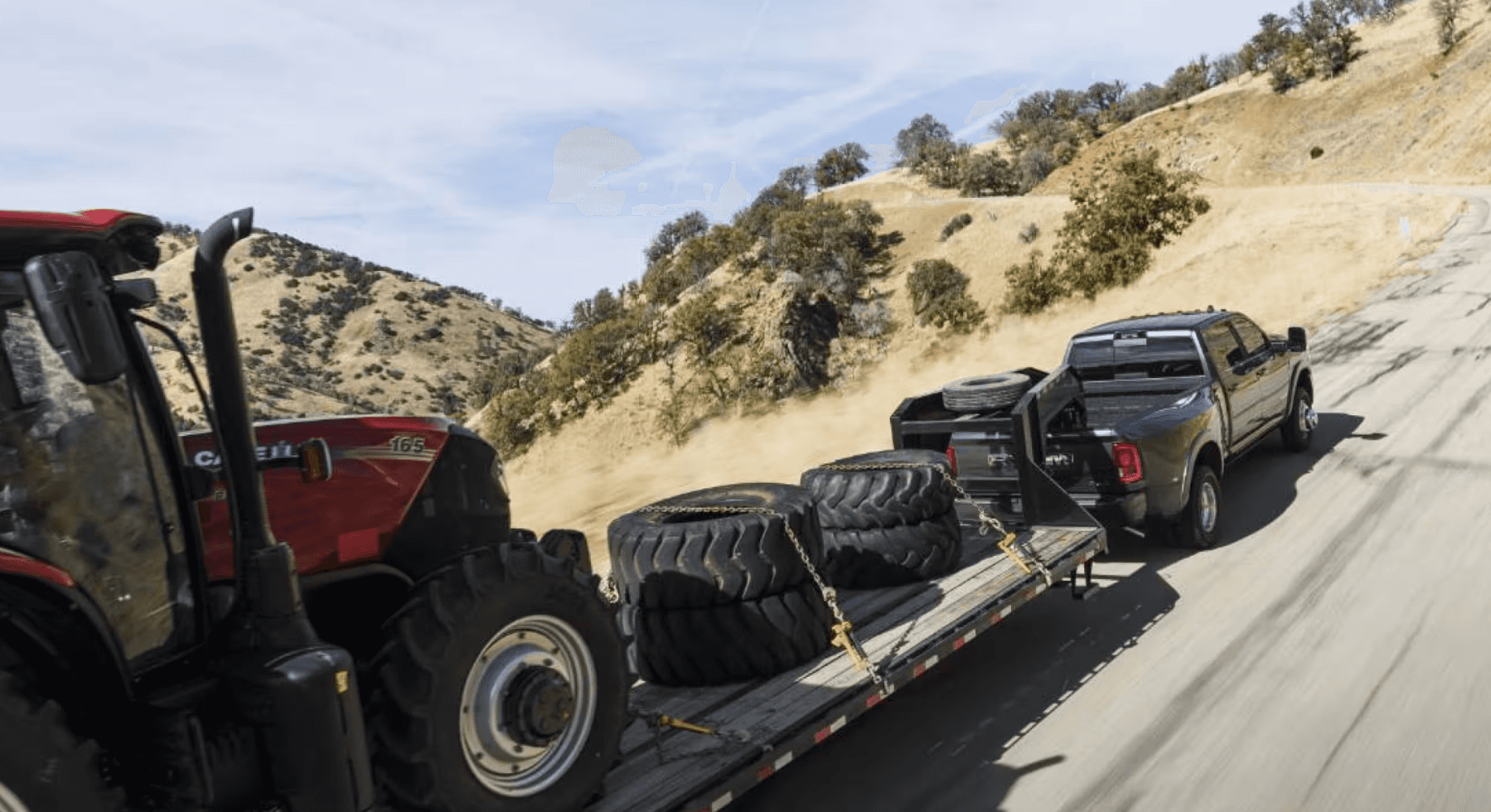New Ram 3500 hauling a tractor