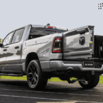 pre-owned 2024 ram 1500 parked at a football field