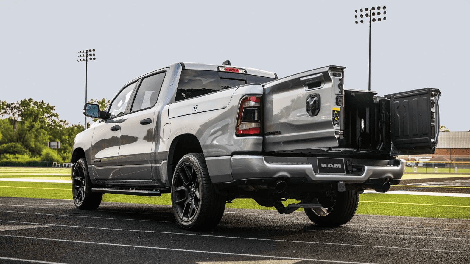 pre-owned 2024 ram 1500 parked at a football field