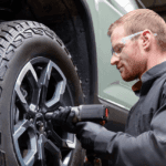 technician replacing a Chevy tire