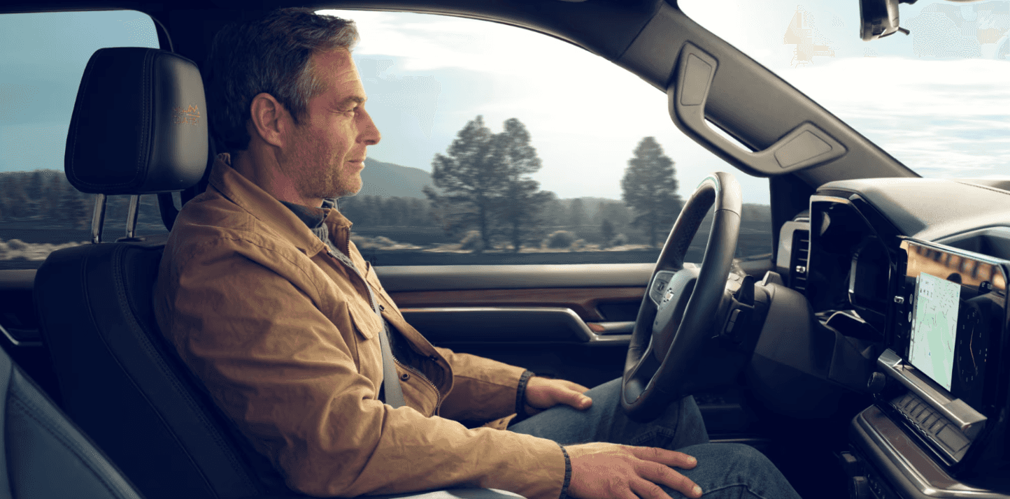 Man inside a Pre-Owned Chevy Silverado 1500 from Conklin Newton
