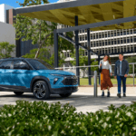 Couple approaching a 2025 Trailblazer at a park