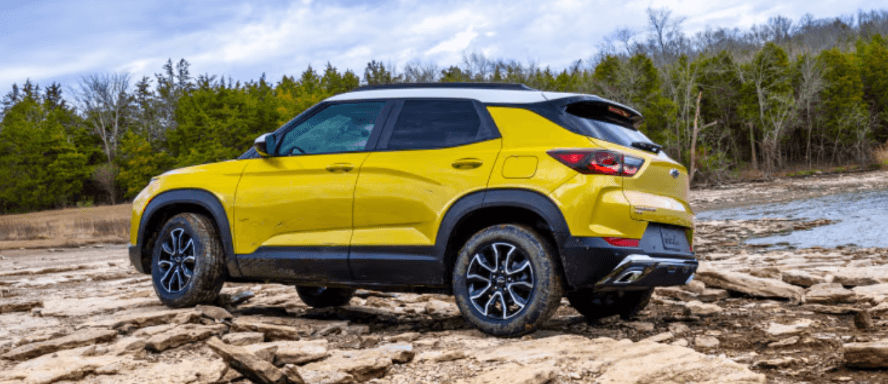 A trailblazer driving through a rocky scenic area