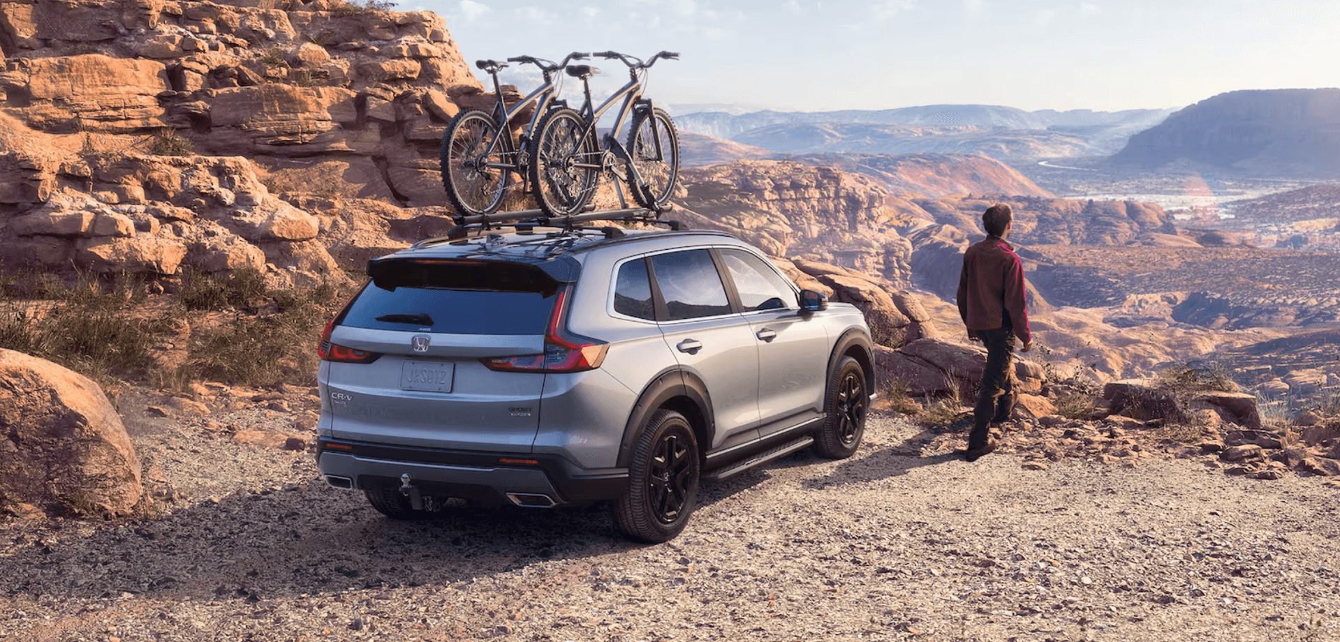 Honda CR-V on a mountain top with bikes on the back