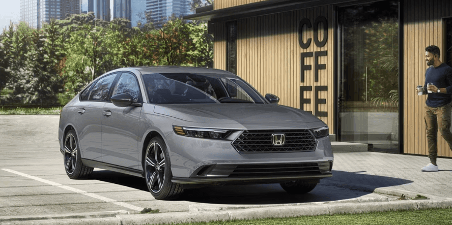 man making a coffee run in a new Honda Accord