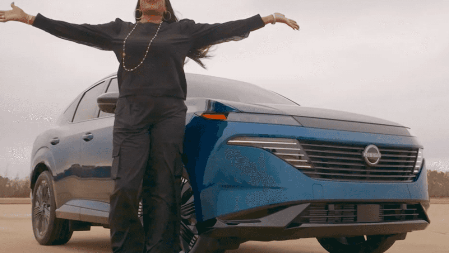 Lady excited about used Nissan special offers in Hutchinson, KS