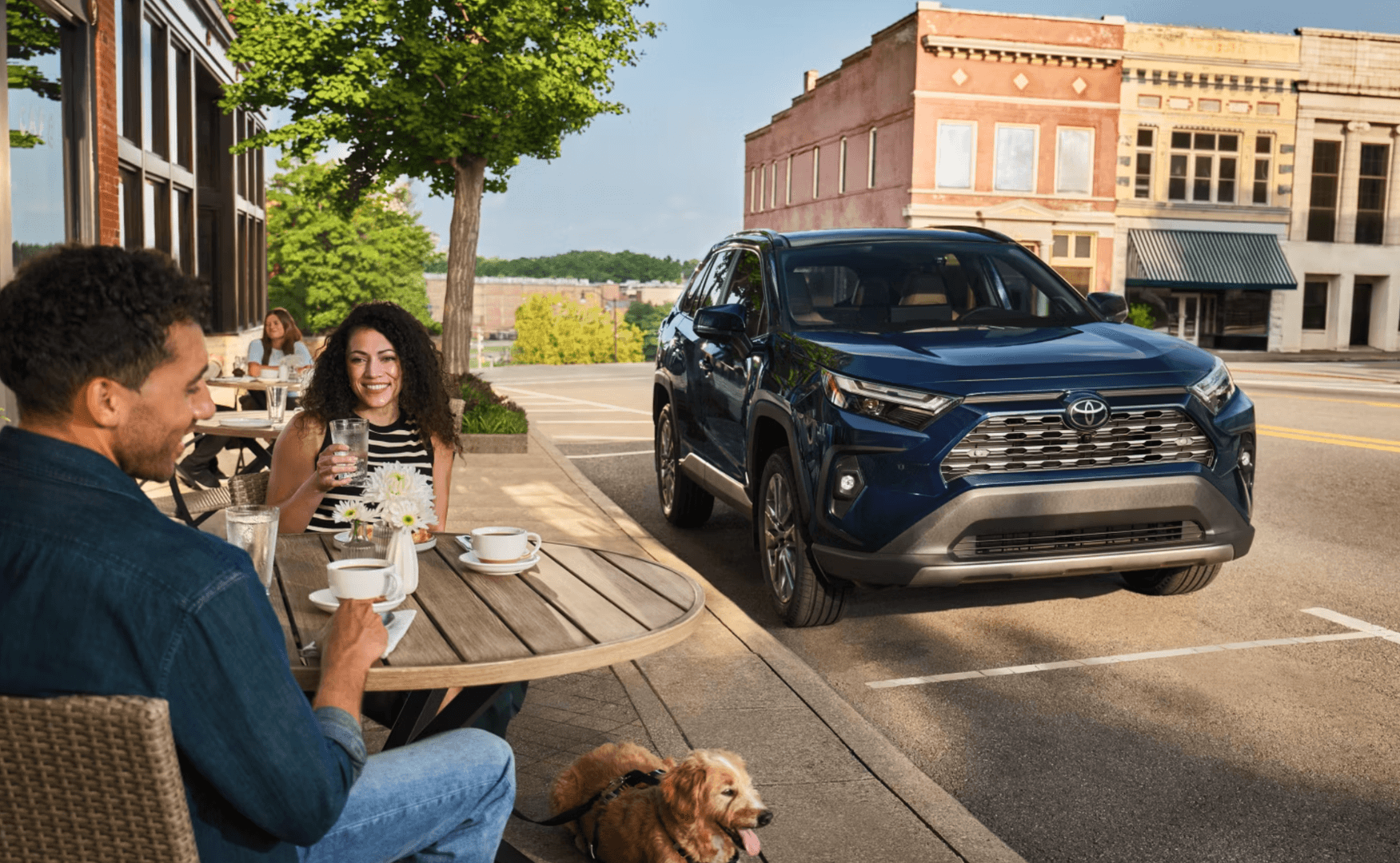 2025 Toyota Rav4 parked outside a cafe