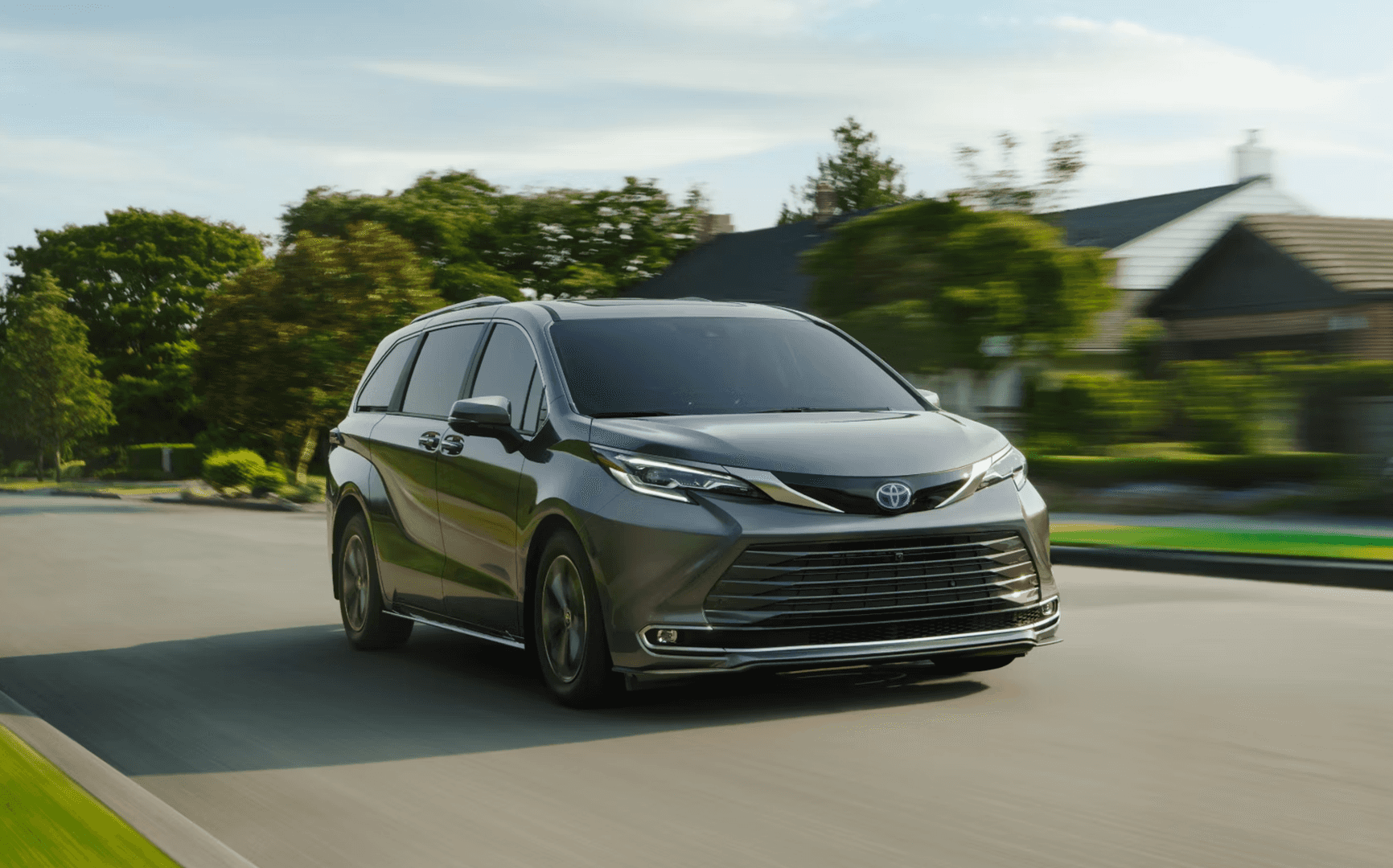 2025 Toyota Sienna driving through the suburbs