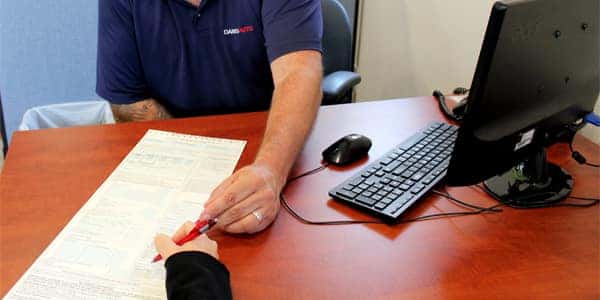 Couple Signing With Financing Certainty