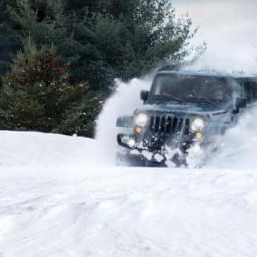 2018 Jeep Wrangler JK driving through snow