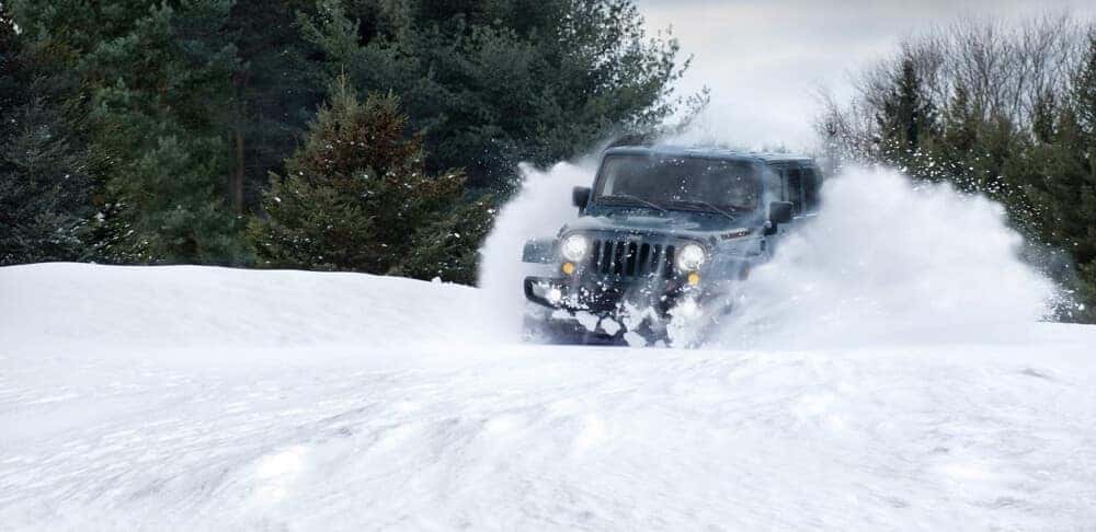 2018 Jeep Wrangler JK driving through snow