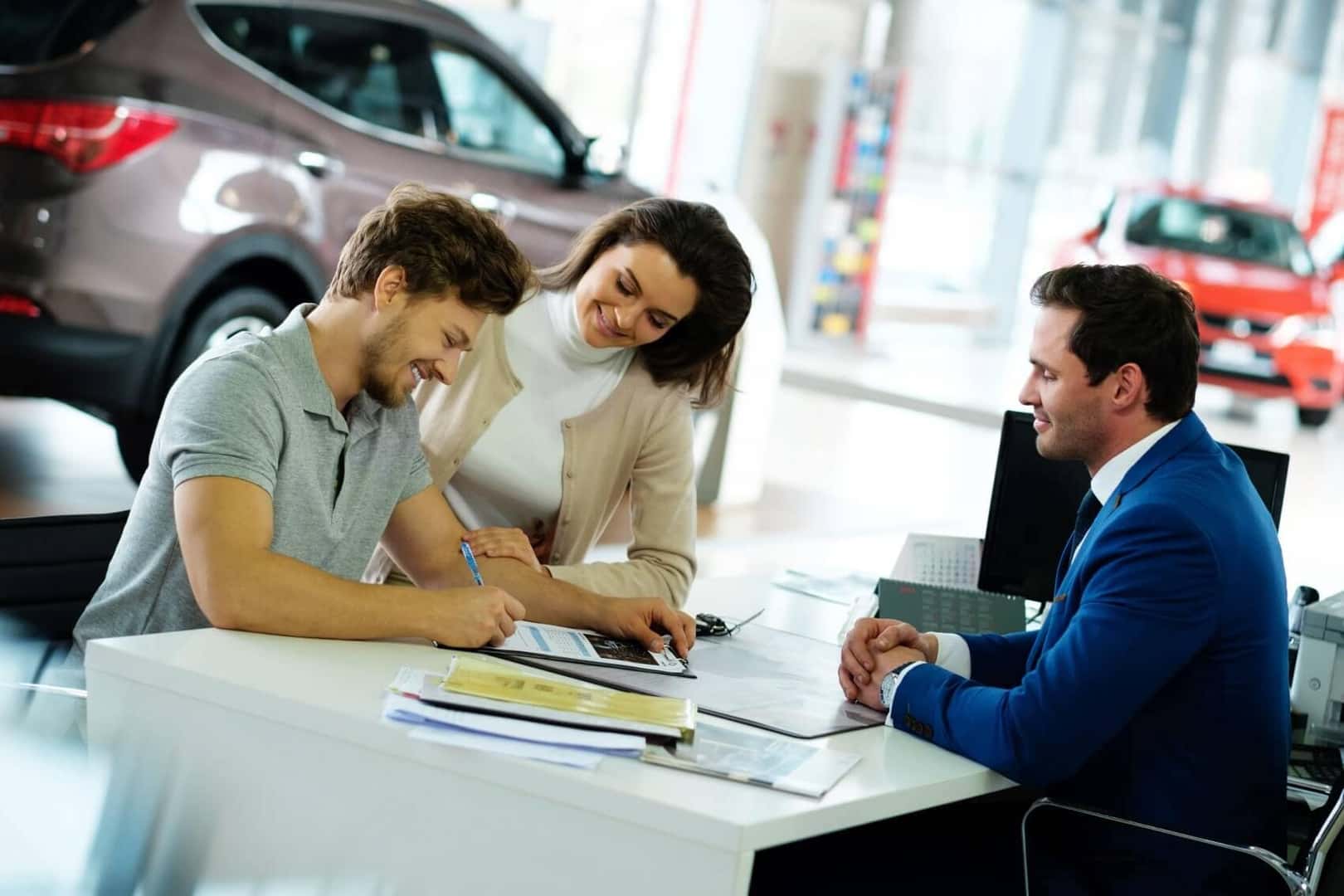 Couple Financing a Car at Dealership near Asbury Park, NJ.