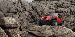 Red Jeep Wrangler Off Roading