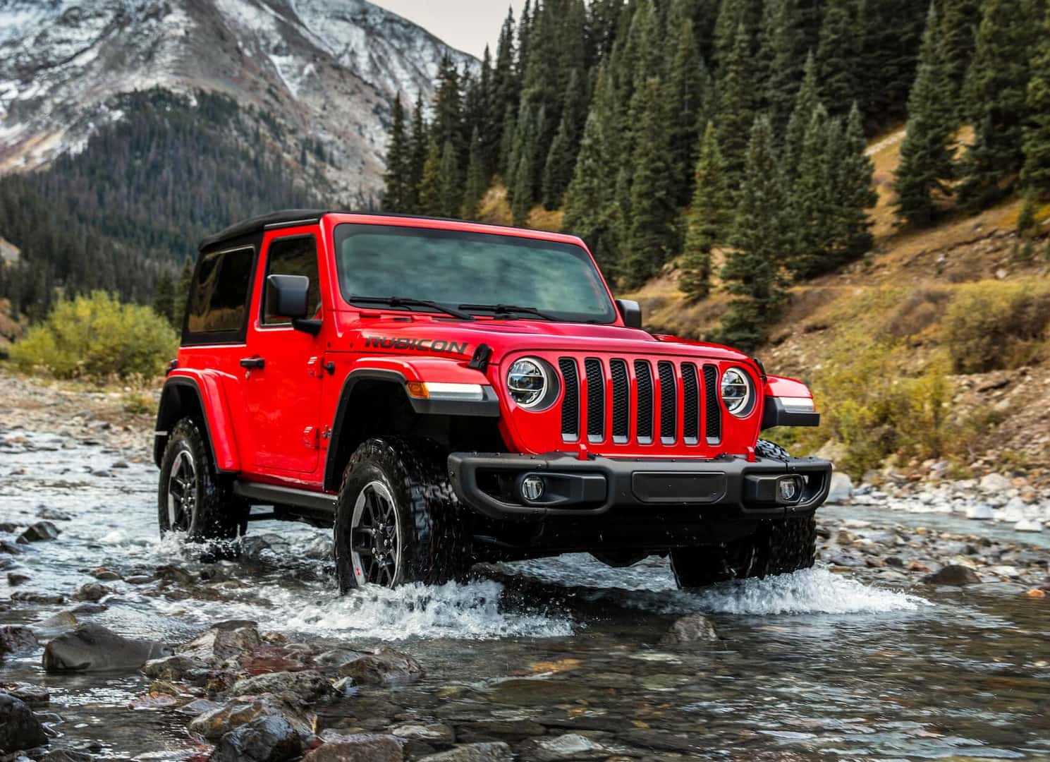 Jeep Wrangler Driving Through Water Crossing