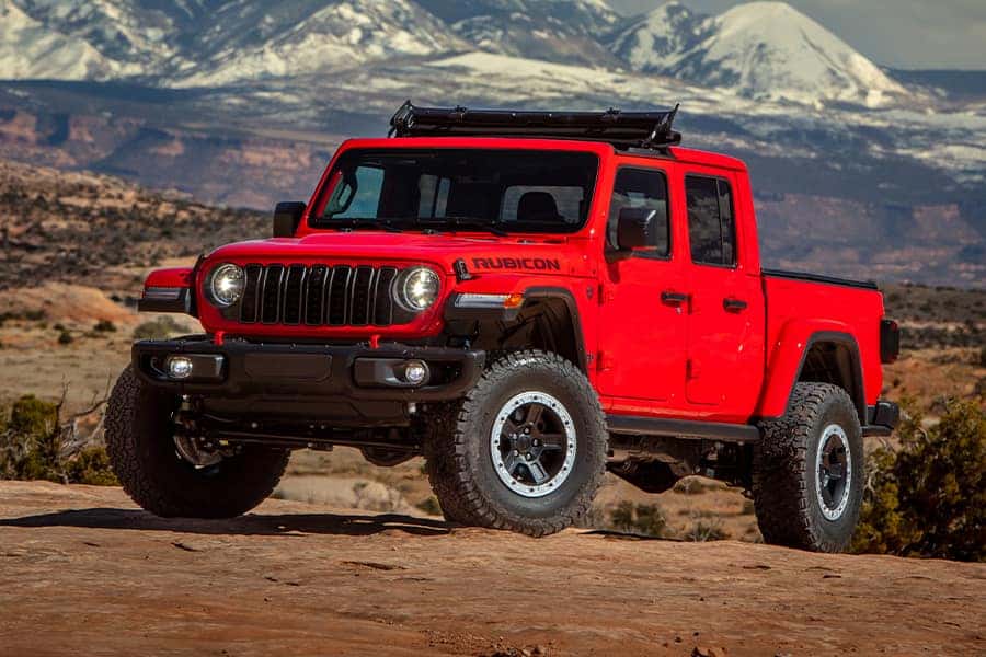 Trail-ready Jeep driving through an outdoor setting