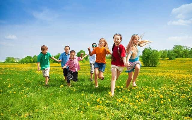 Kids Running in Grass