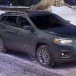 Jeep Cherokee on snowy street thumbnail