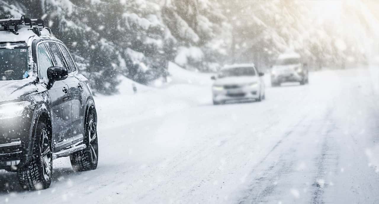 snowy road cars driving