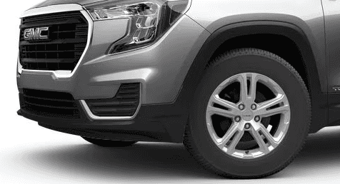 Closeup of the front driver's side wheel of a silver 2024 GMC Terrain