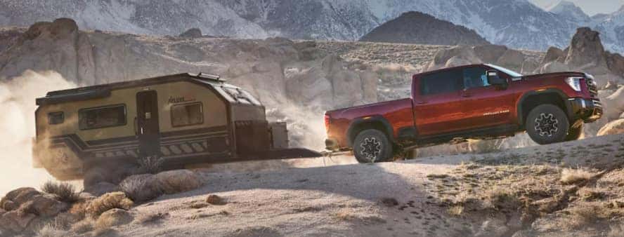 GMC Sierra 2500 HD truck towing a trailer