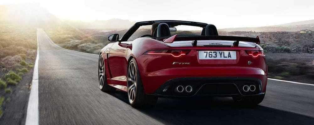 red jaguar driving fast