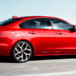 2020 jaguar xe red driving on road