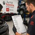 Technician holding clipboard with MPI inspection checklist