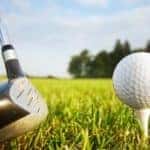 Golf ball on tee and golf club