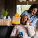 Woman surprising dad with Father's Day gift.